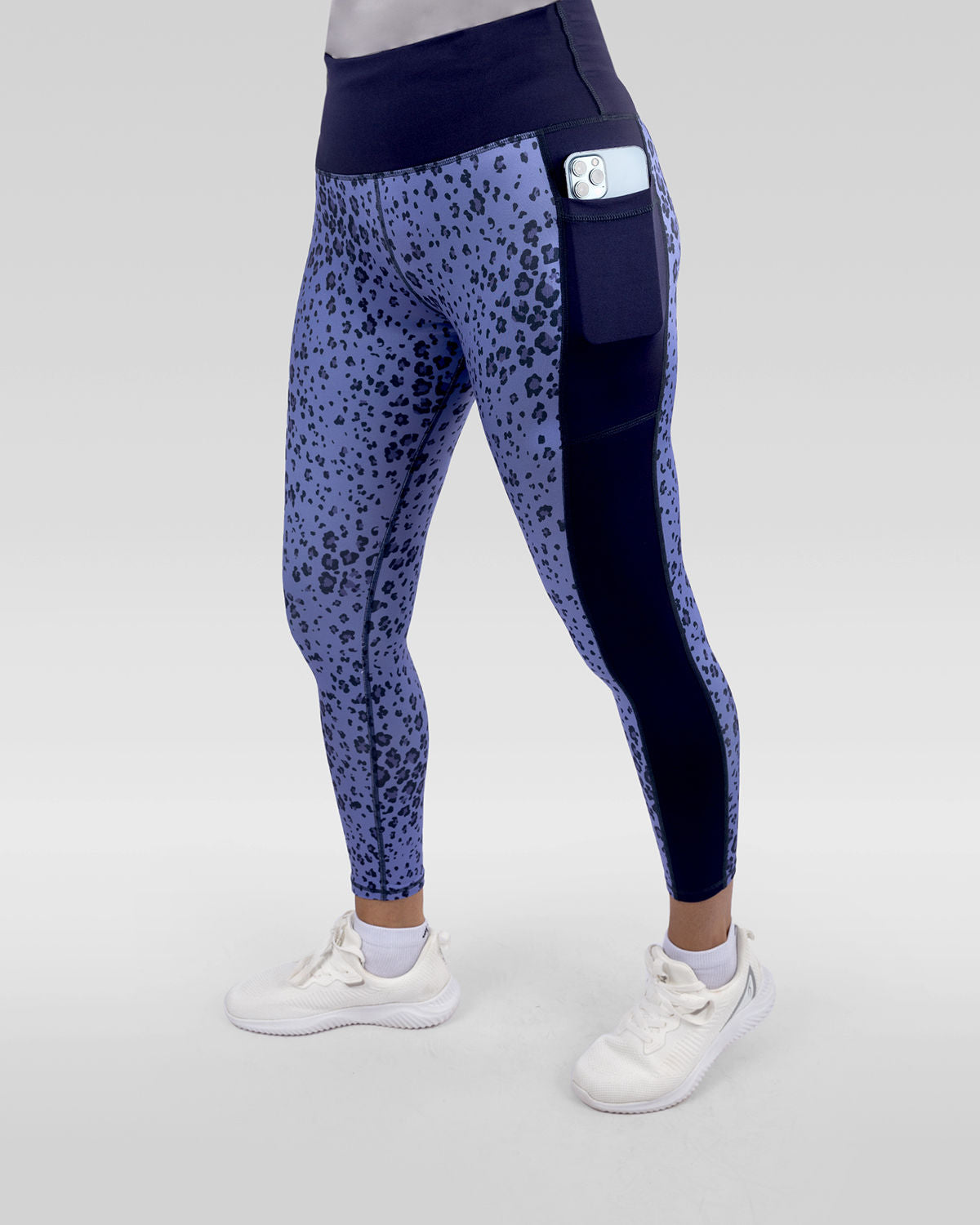 Photo by ð—”ð—§ð—¨ð— SPORTSWEAR Â® on December 20, 2022. May be an image of 1 woman wears printed purple/navy floral leggings, and white shoes.